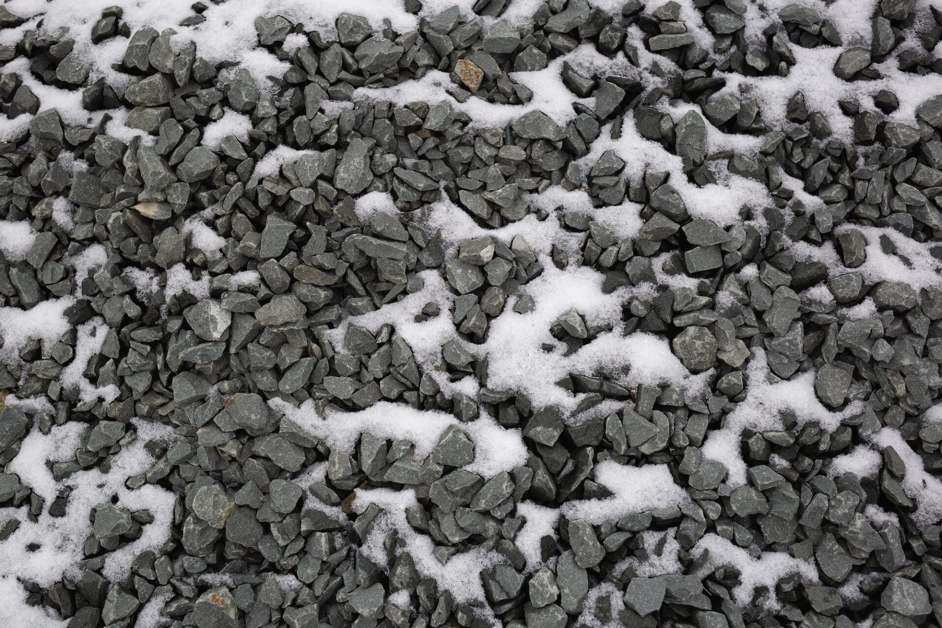 dark gray gravel in the snow. great background for your design